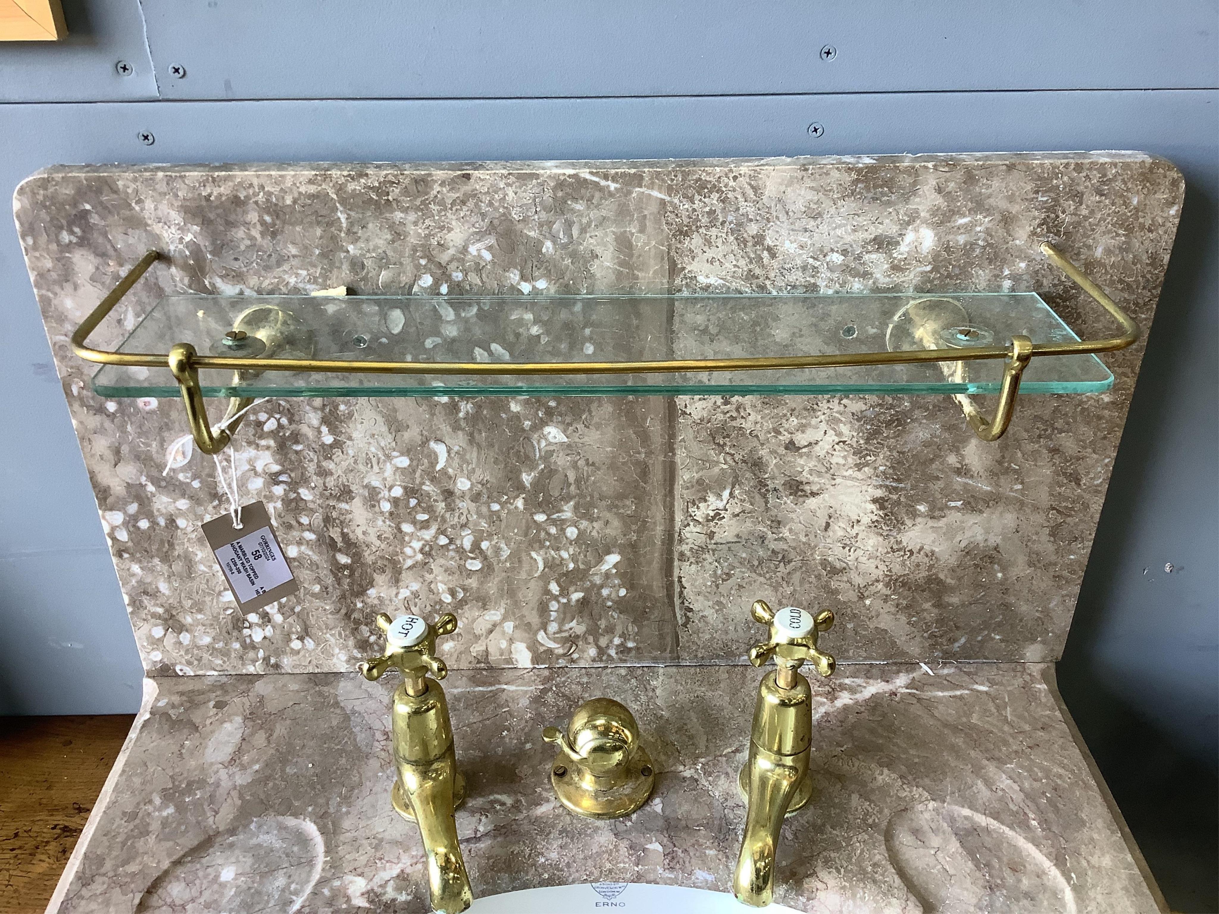 A marbled topped mahogany wash basin with John Bolding & Sons Erno ceramic basin and brass metal work, width 69cm, height 117cm. Condition - two old repair cracks to the marble top near front right, otherwise fair